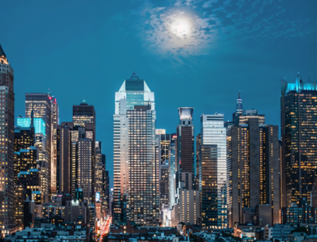 City skyline with moon overhead